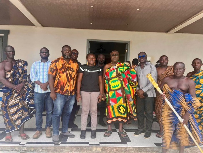 Menxons team with a traditional chief and elders during a courtesy call in the Jomoro District