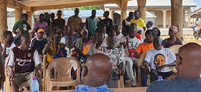 Community durbar gathering attended by residents during the Tikobo 1 community entry programme